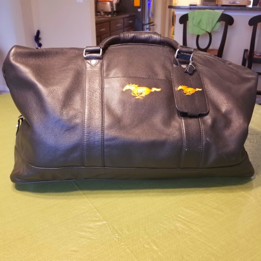 NWOT Large,faux-leather bag in black - Mustang insignia. Never used.